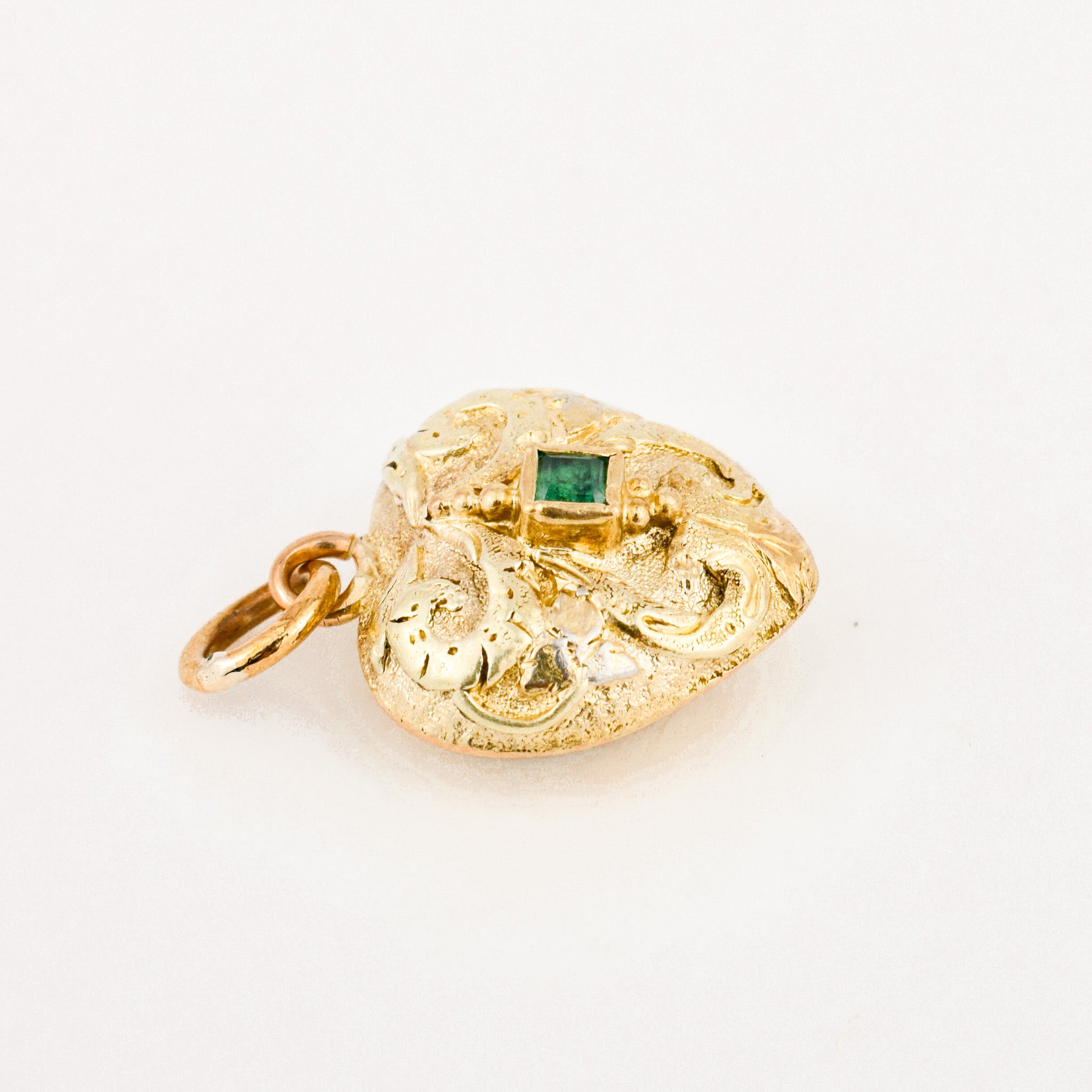 antique heart mourning locket with emerald stone