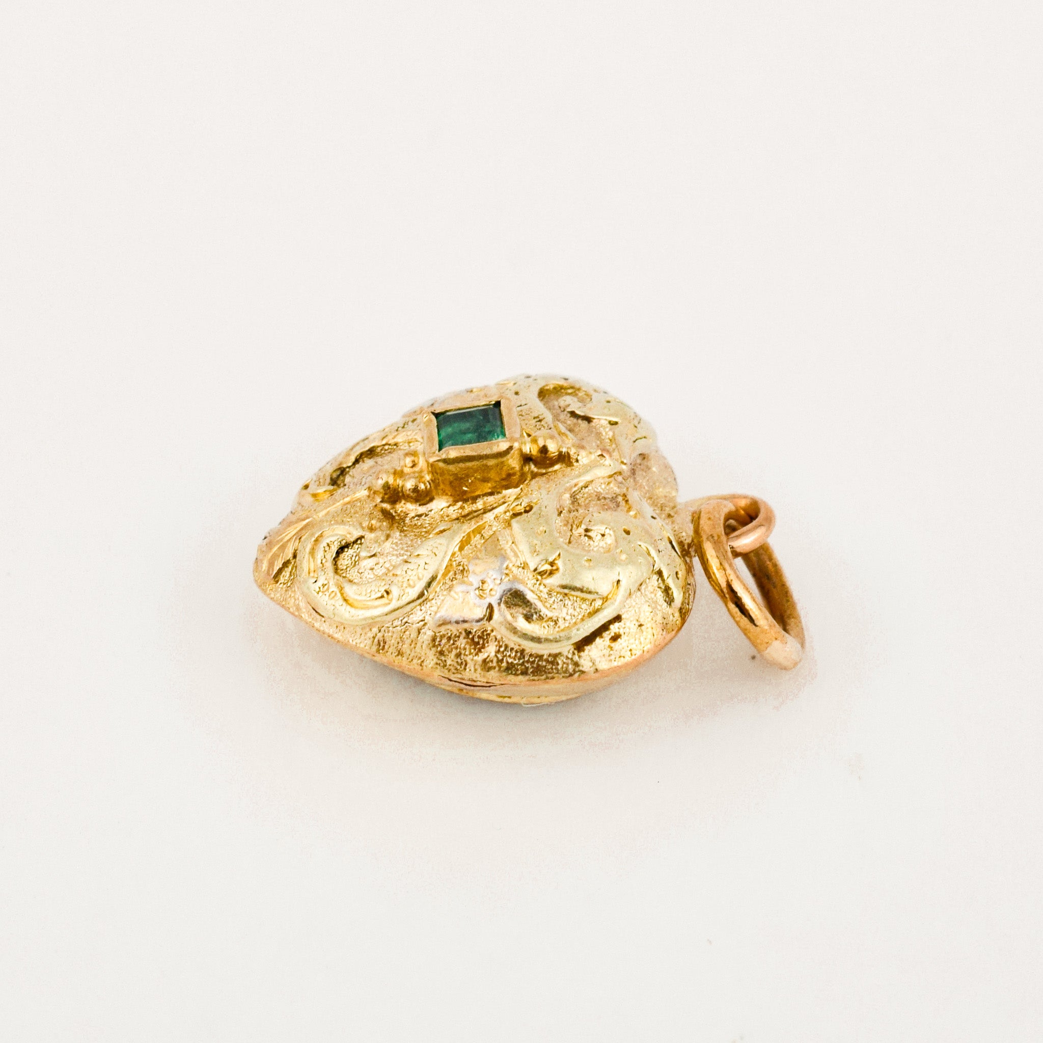 antique heart mourning locket with emerald stone