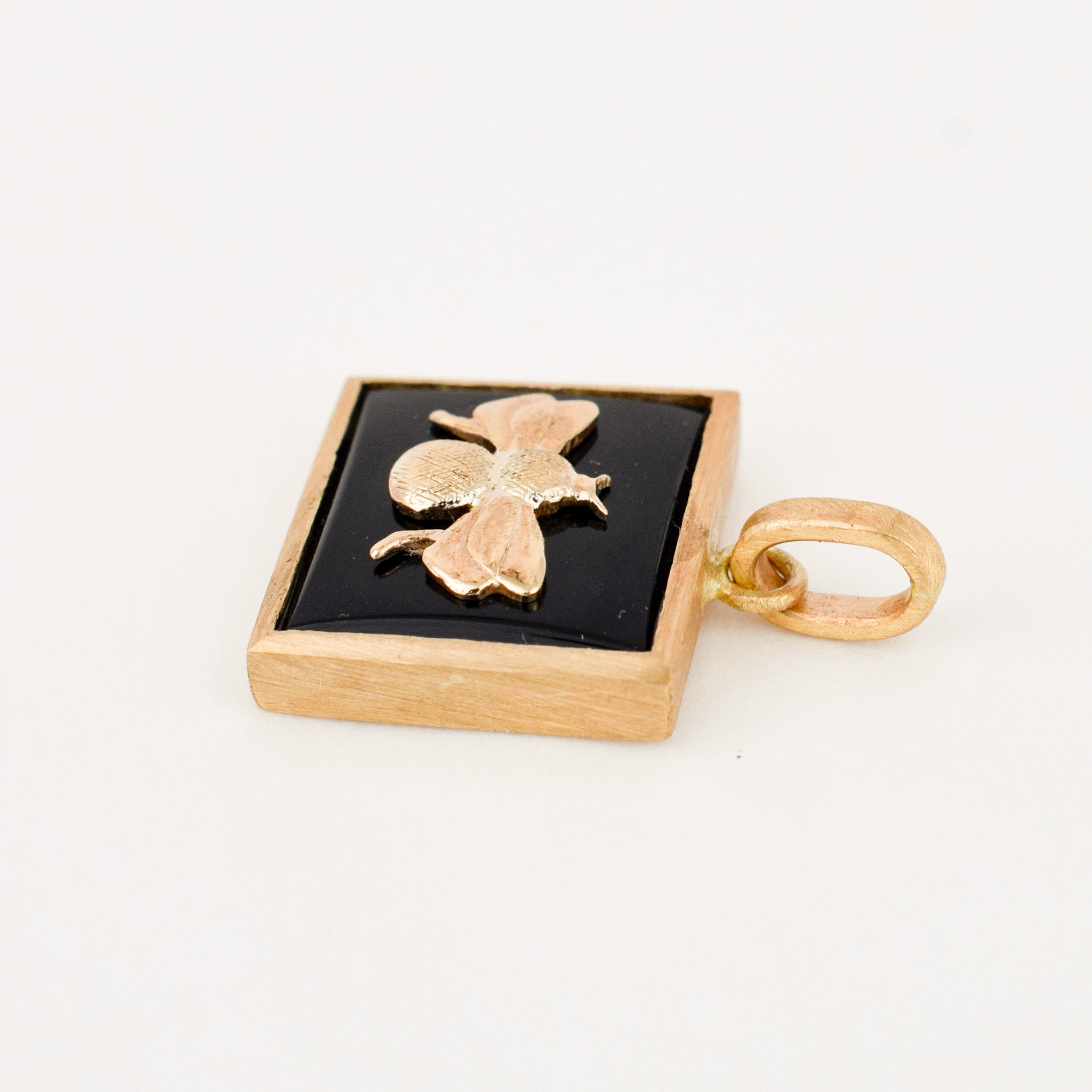 Bezel Set Onyx and Gold Bee Pendant