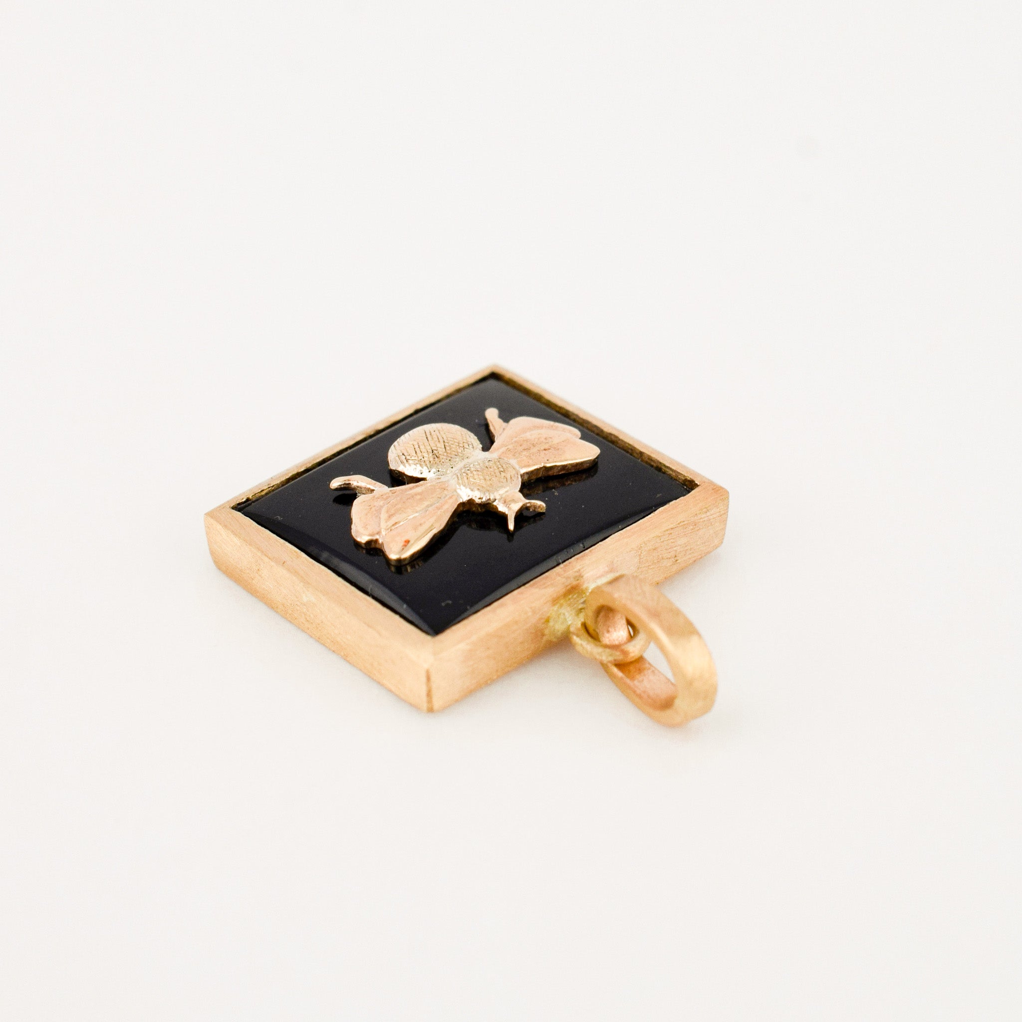 Bezel Set Onyx and Gold Bee Pendant