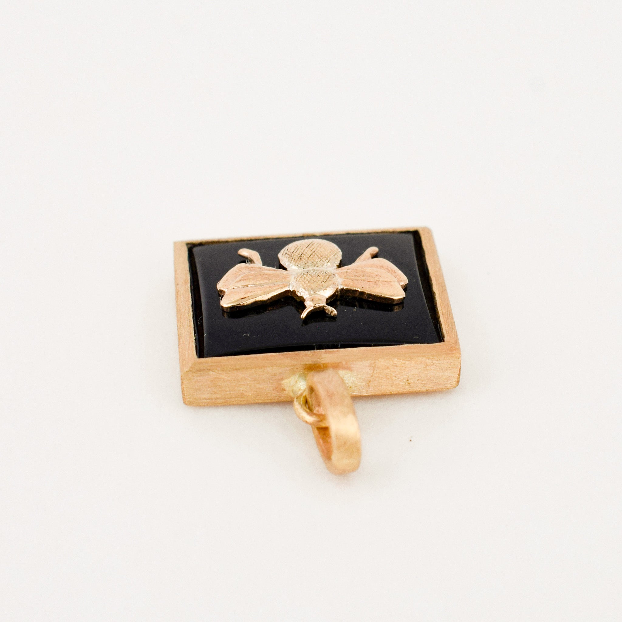 Bezel Set Onyx and Gold Bee Pendant
