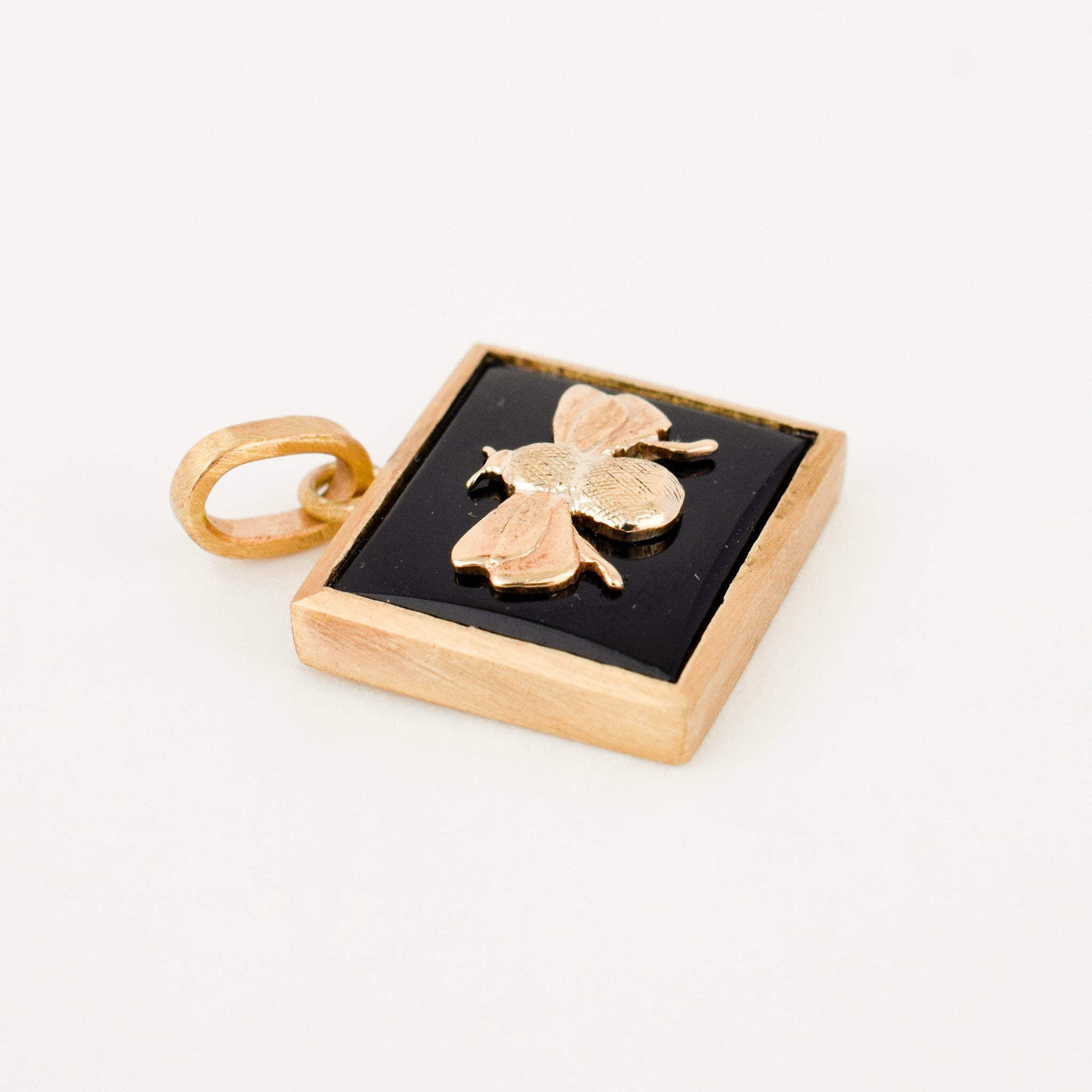 Bezel Set Onyx and Gold Bee Pendant