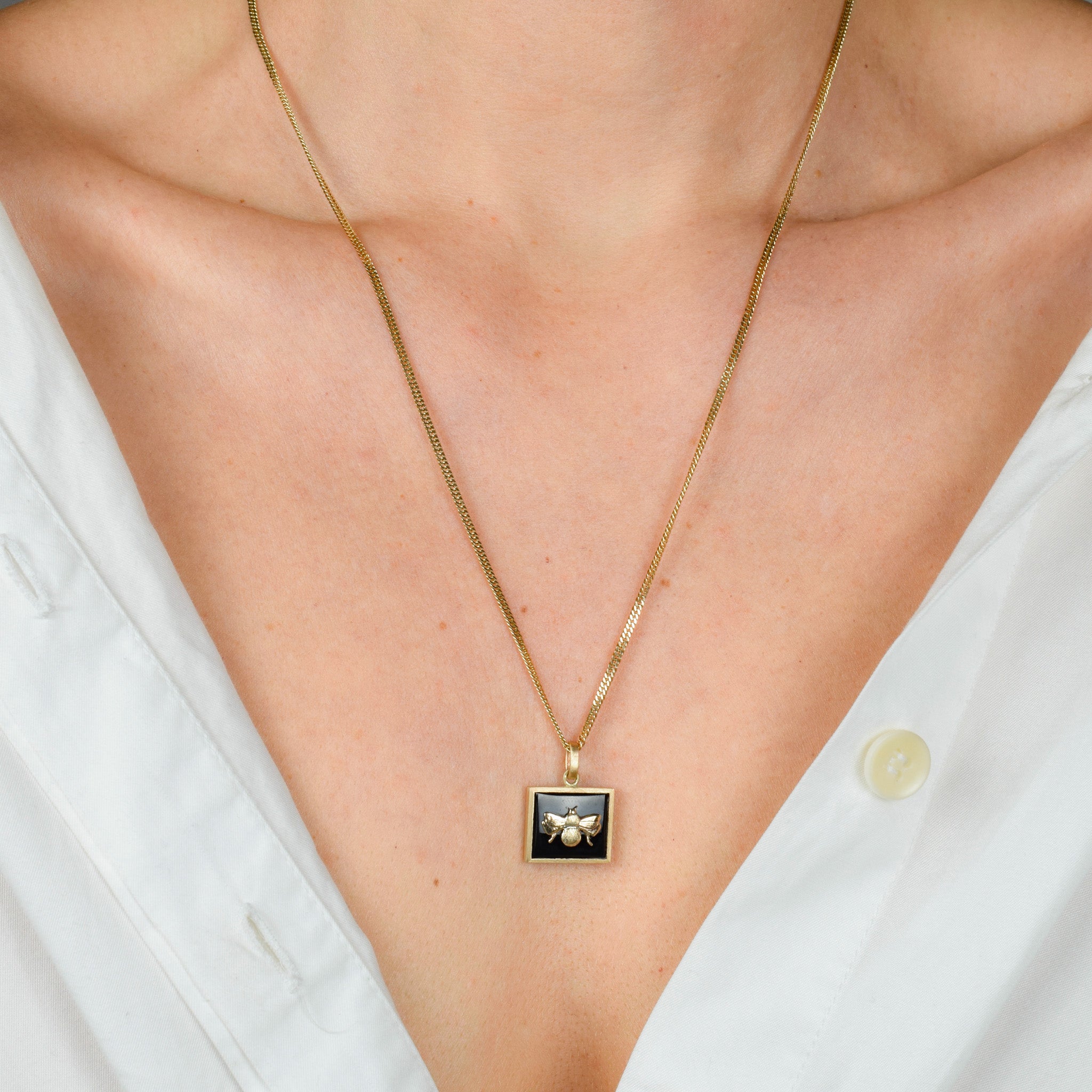 Bezel Set Onyx and Gold Bee Pendant