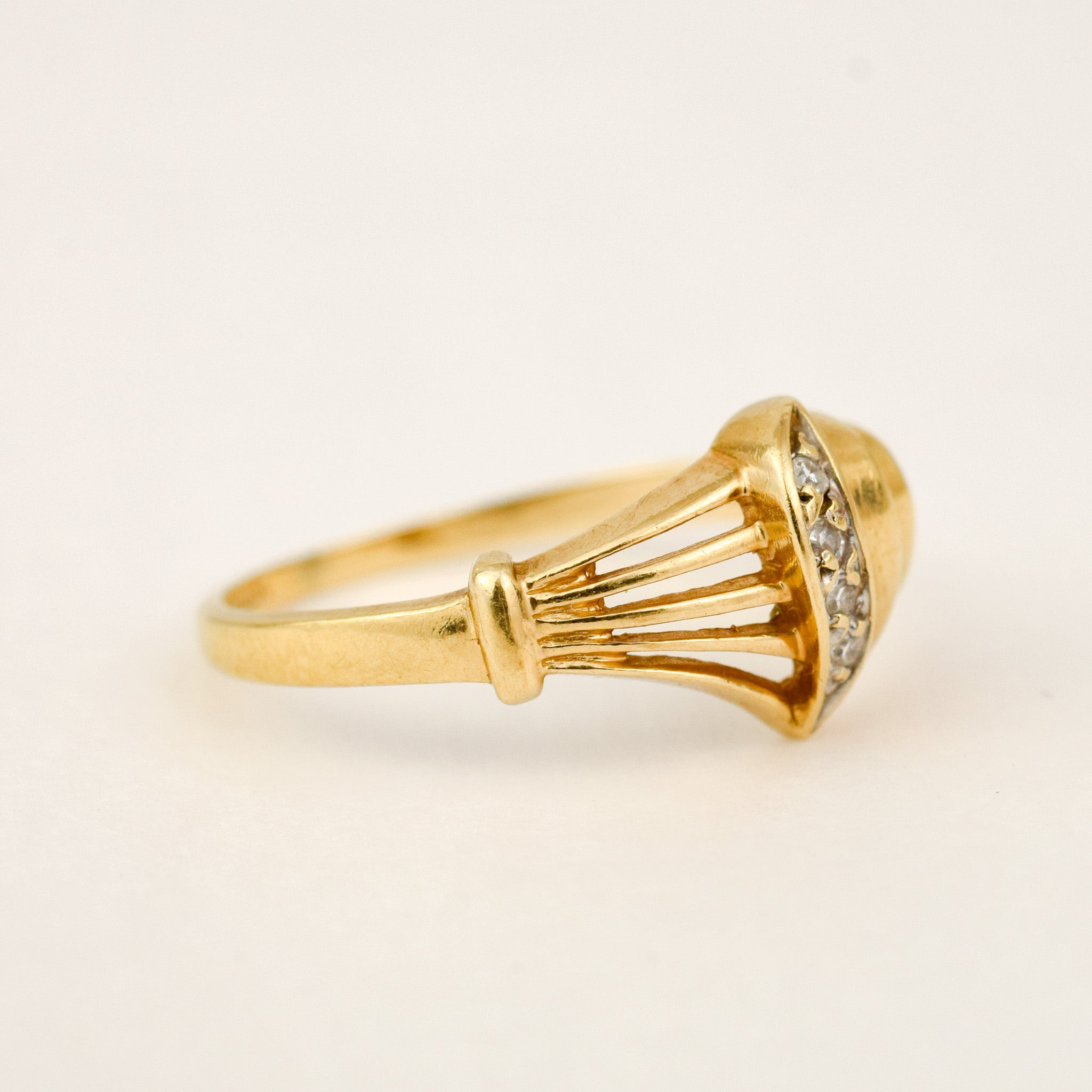 Sculptural Shell and Diamond Ring, top-down view of the ribbed shell body and diamond accent line