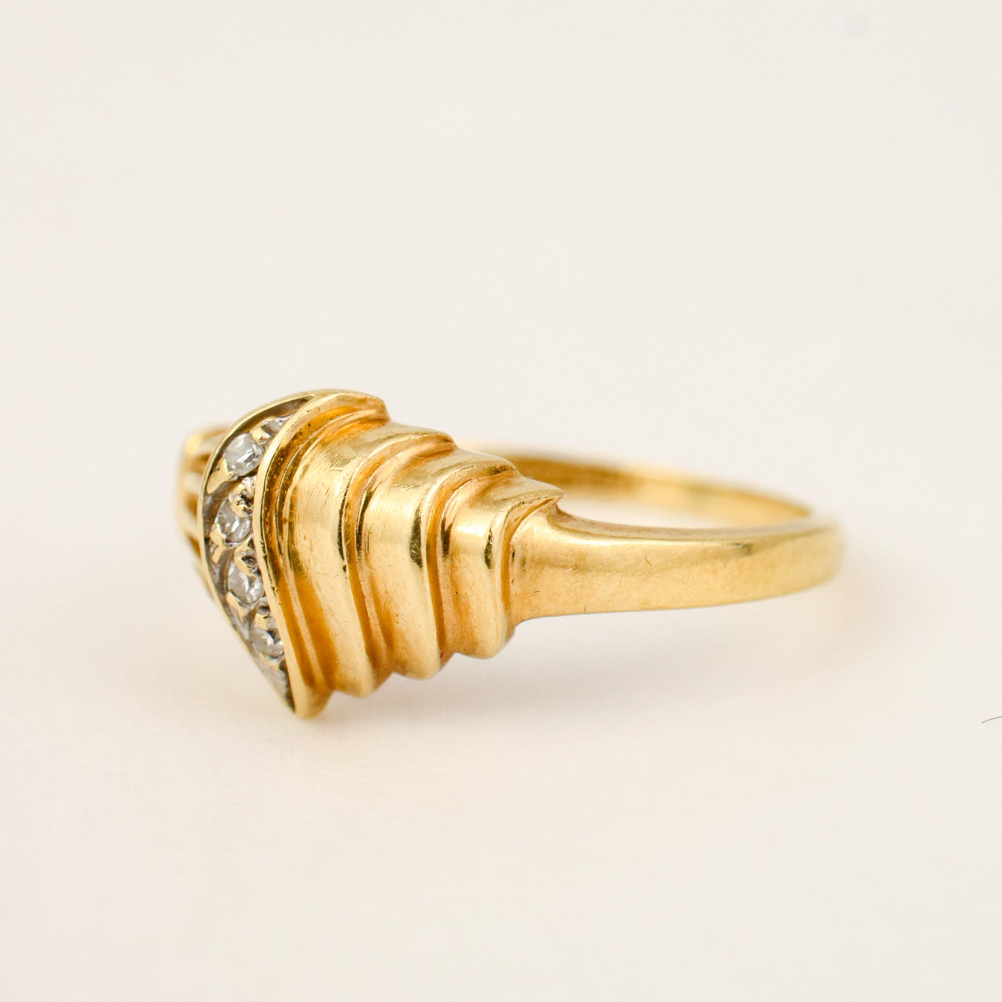 Sculptural Shell and Diamond Ring, side view of the Retro-era sculpted gold form