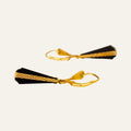 Pair of elongated black onyx drop earrings capped with cross-hatched 10k yellow gold, on leverback wires