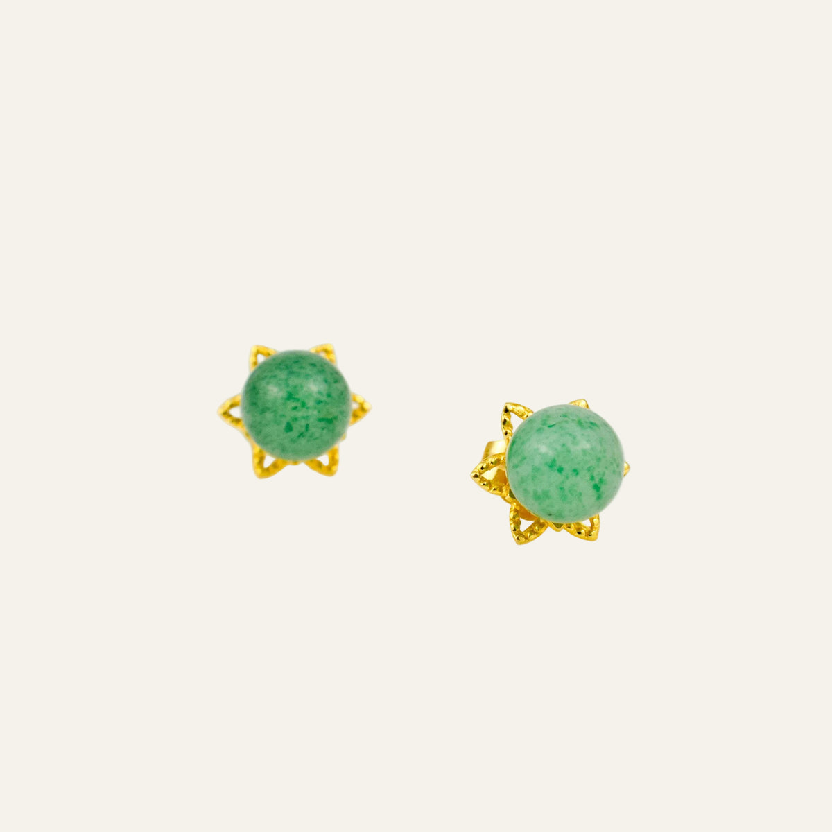 Vintage 14k gold stud earrings with round green quartz cabochons in splayed floral prong settings.