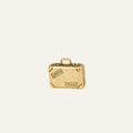 9k yellow gold suitcase charm with corner caps, top handle, and travel stickers reading London and Paris