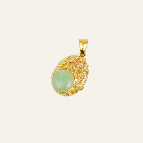 14k yellow gold pendant with a round jade cabochon set in freeform coral-like textured goldwork