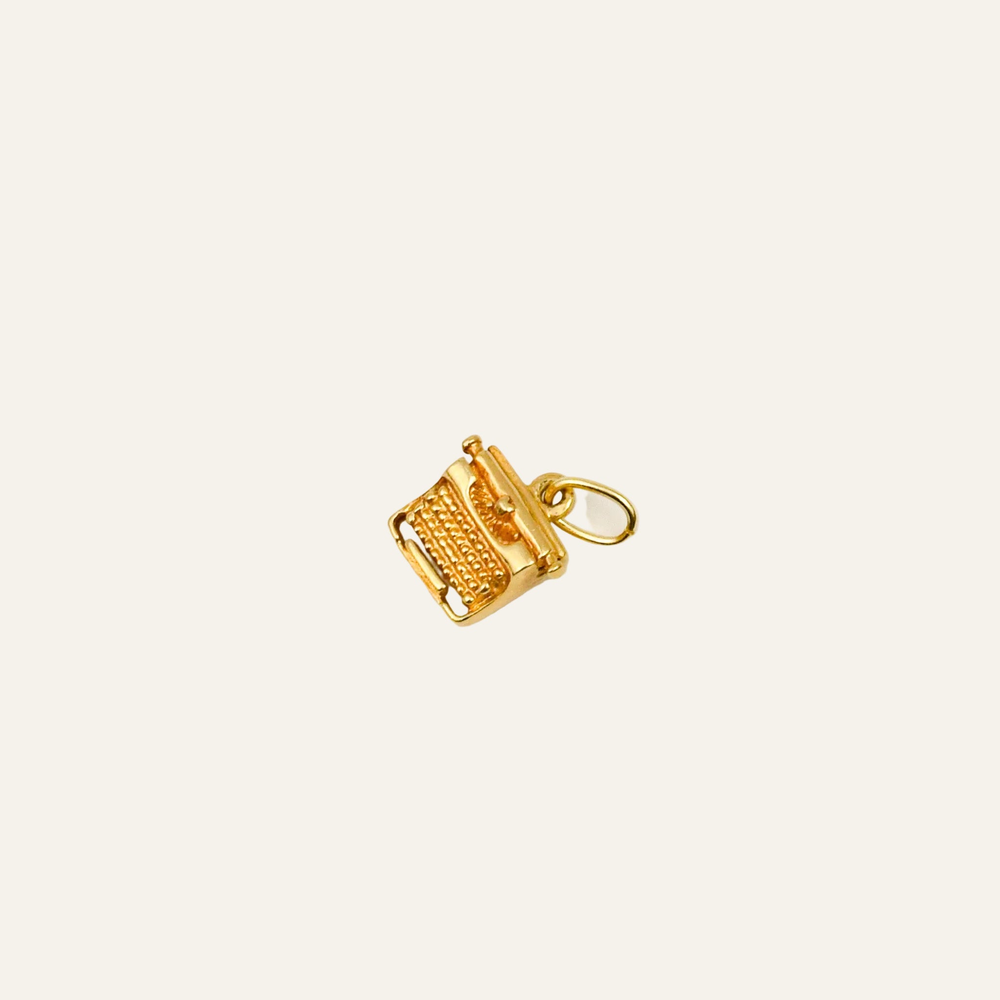 Miniature 10k yellow gold typewriter charm with beaded keys, roller, and return lever