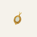Vintage 14k gold pendant with an oval opal in a scrolled gold frame with beaded detail.