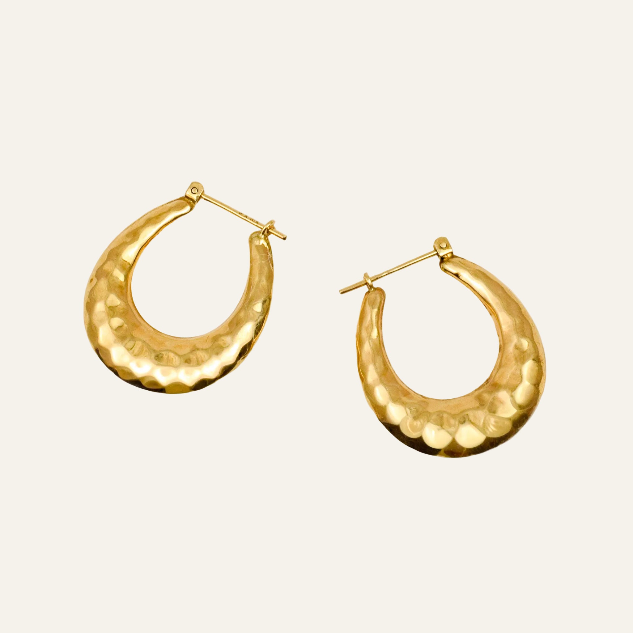 Pair of 26.3mm hand-hammered 10k yellow gold hoop earrings with a soft faceted texture