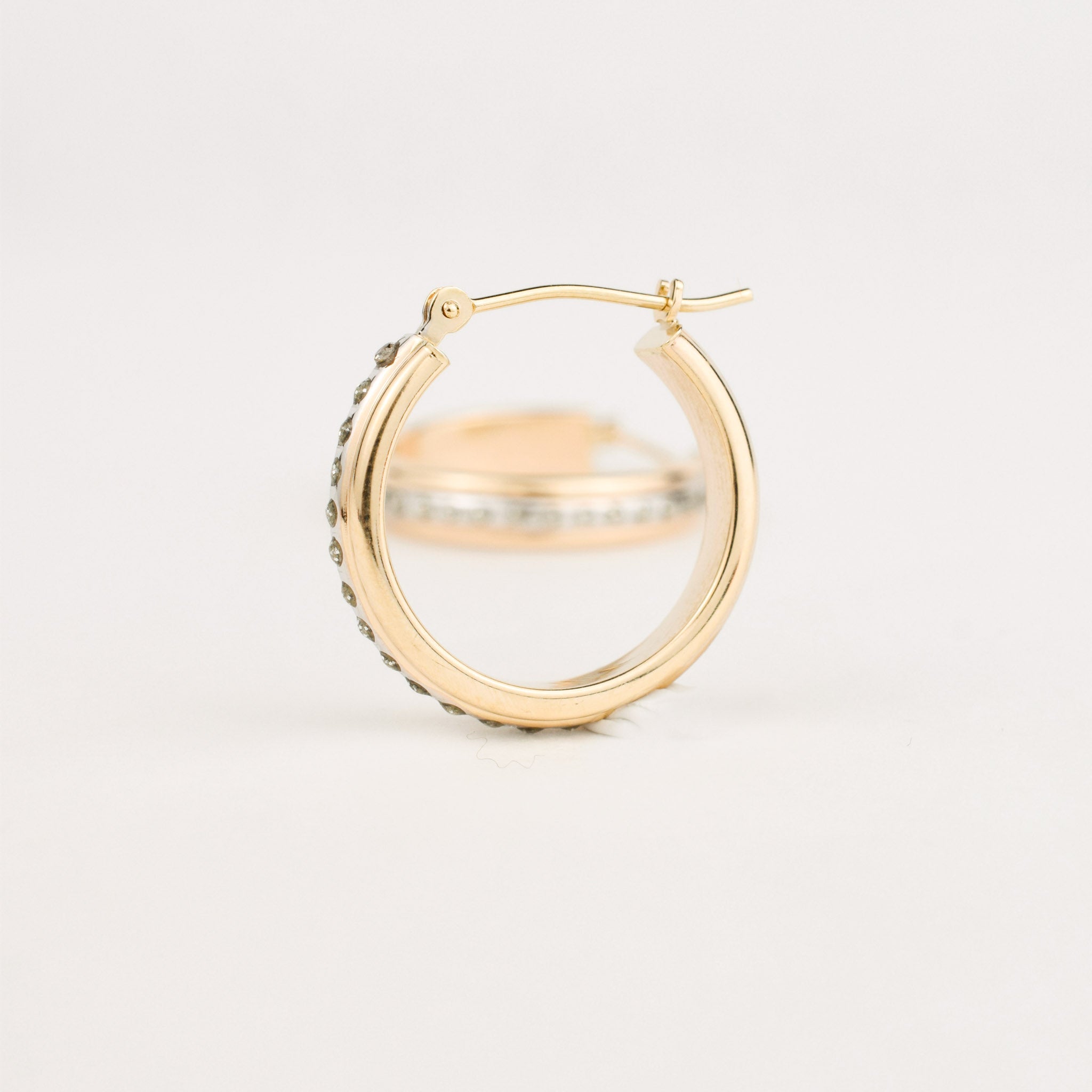 gold hoops with beaded diamond looking detail 