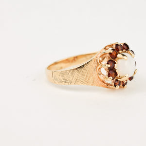 gold Opal Ring with Garnet Halo 