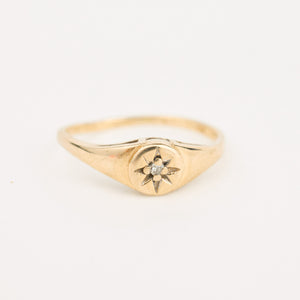 gold diamond starburst pinky signet ring 