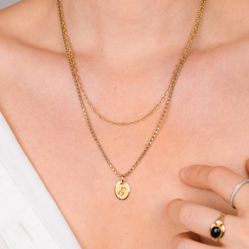 'e' gold charm pendant 